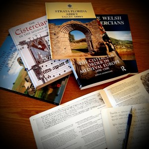 Colour photograph of books about Cistercians, and a notebook.