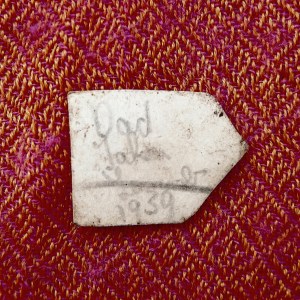 Image of back of small photograph, with pencil writing.