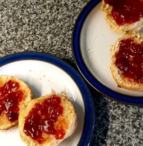 Photograph of scones with butter and jam