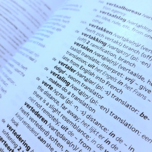 Photograph of part of a page from a Dutch/English dictionary, showing the entries for 'vertalen' (to translate), 'vertaler' (translator) and 'vertaling' (translation).